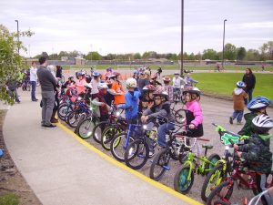 Bunch of kids are getting together for riding their bike with the supervisor