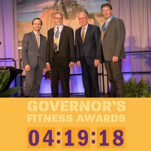 A group of Michigan officials at the Governor's Fitness Awards with Steudle (center right).