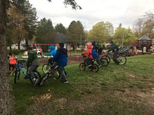 Students on their bikes getting ready to start going at the remote drop site in Hart.