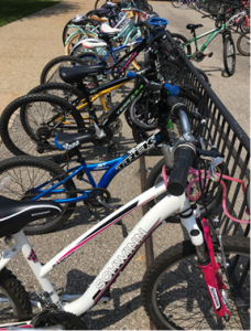 A bike rack full of student bikes from Bike to School day