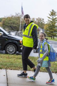 Walking School Bus Coordinator with her daughter walking to school