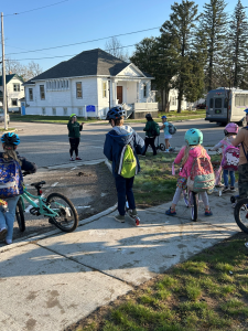 Students from Grayling Elementary get instructions before heading out to school as part of a bike bus or bike train.