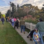 A group of community members and students participating in the Bath Walk and Roll to School Day.