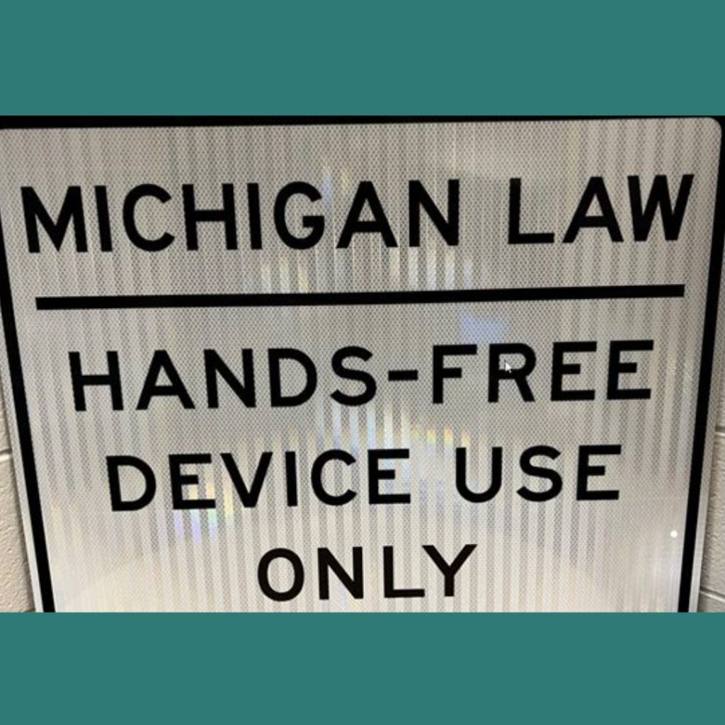 Michigan Law Hands-Free device Use only road sign. Photo Credit: Michigan OHSP