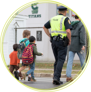 Police helping children cross the road